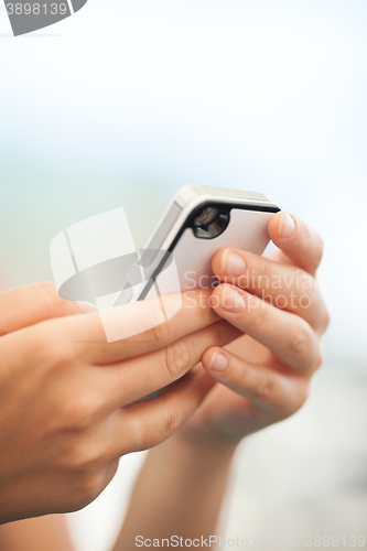 Image of Child checking a text message on a mobile
