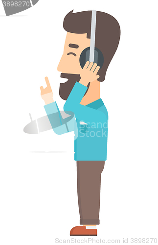 Image of Man listening music in headphones
