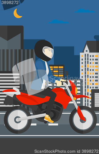 Image of Woman riding motorcycle.