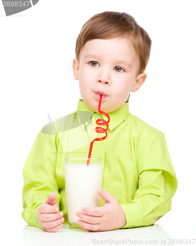 Image of Cute little boy with a glass of milk