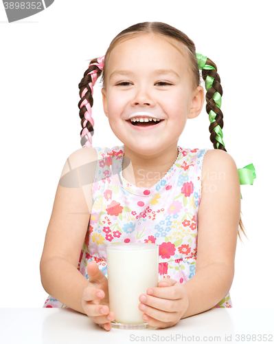 Image of Cute little girl showing milk moustache