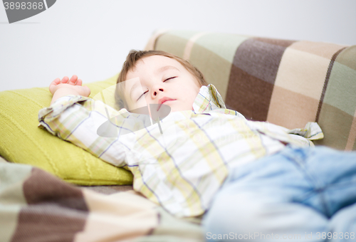 Image of Cute little boy is sleeping