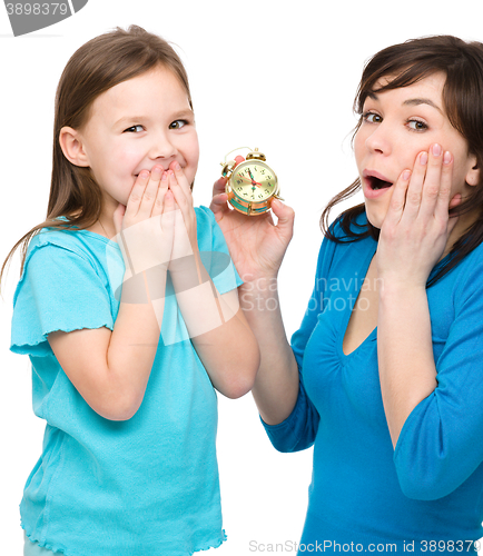 Image of Little girl and her mother are anxious about time