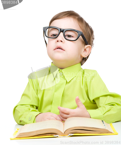 Image of Little child play with book