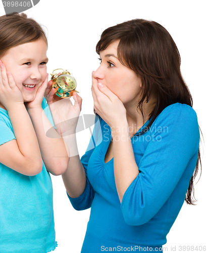 Image of Little girl and her mother are anxious about time