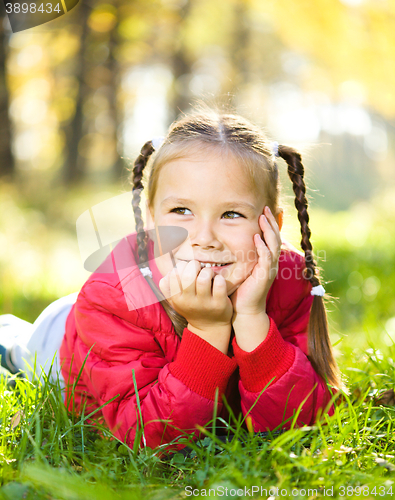 Image of Portrait of a little girl in autumn park