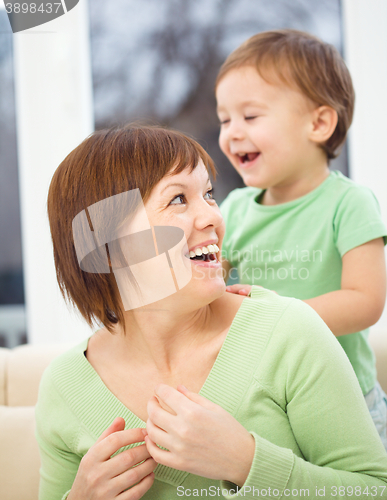 Image of Mother is having fun with her son