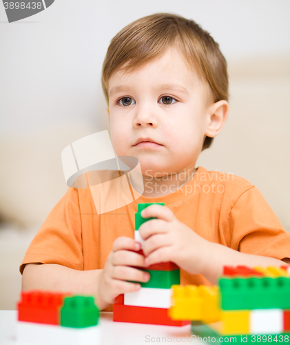 Image of Boy is playing with building blocks