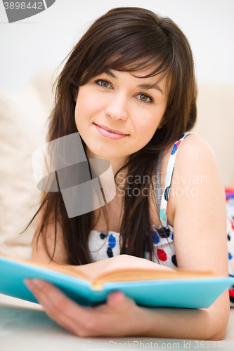 Image of Woman is reading a book