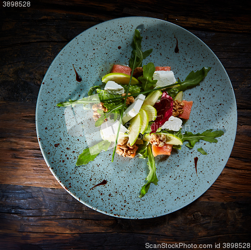 Image of Homemade salad with apple and salmon