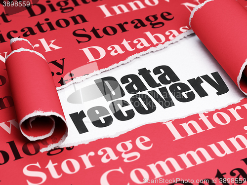 Image of Information concept: black text Data Recovery under the piece of  torn paper