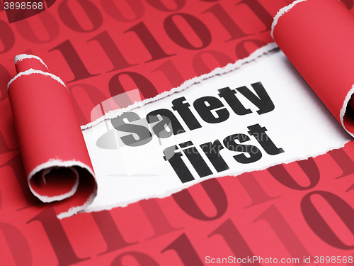 Image of Privacy concept: black text Safety First under the piece of  torn paper