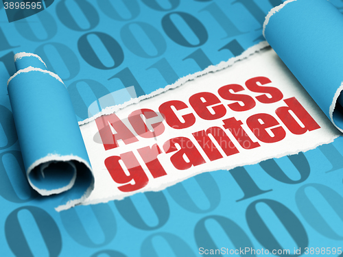Image of Security concept: red text Access Granted under the piece of  torn paper