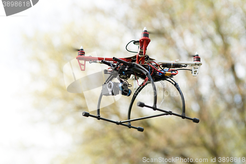 Image of Quadrocopter while flying in the forest. 