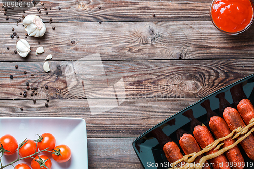 Image of Sausage roasted on the grill.