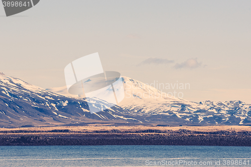 Image of Snow on mountains by the sea