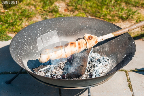 Image of Bonfire in a garden with grilled bread