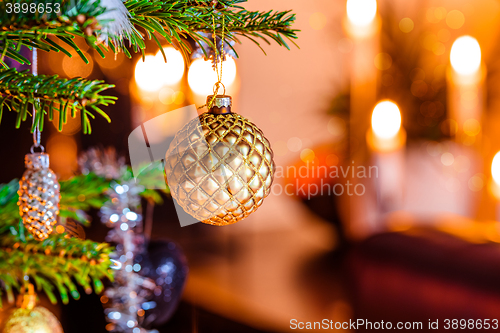 Image of Christmas tree with a golden bauble