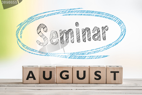 Image of August seminar sign on a scene