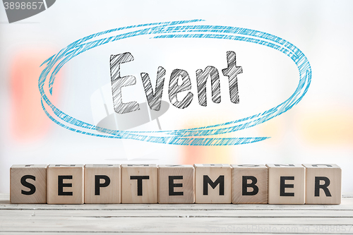 Image of September event sign with blue sketch