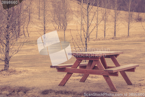 Image of Wooden bench in a park