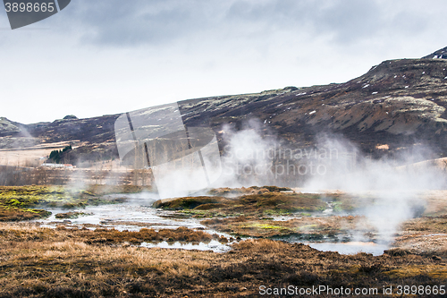 Image of Misty swamp beneath a mountain