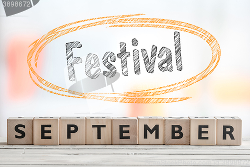 Image of September festival sign with orange sketch