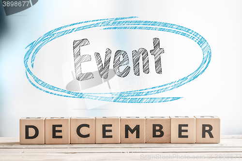 Image of December event sign on a stage