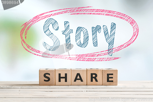 Image of Share story sign on a table