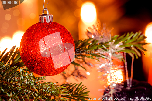 Image of Red Christmas bauble and shiny lights