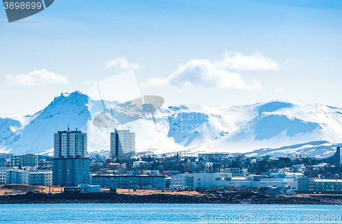 Image of Reykjavik city in Ieland beneath a mountain