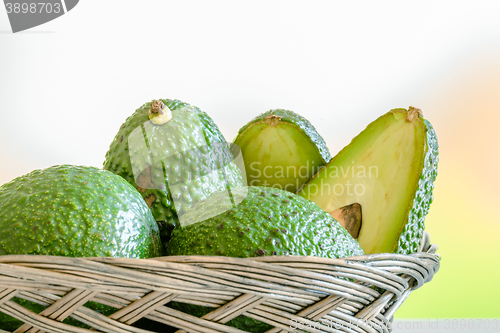 Image of Avocado stacked in a basket