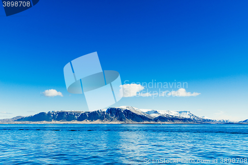 Image of Blue ocean with distant mountains