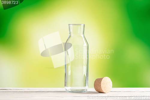 Image of Empty glass bottle with a cork