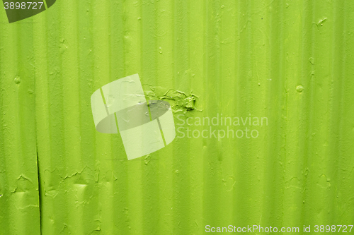 Image of Green metal surface with worn paint