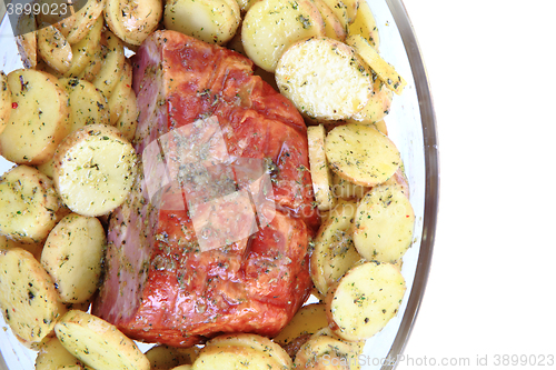 Image of smoked meat and raw potatoes 