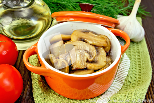 Image of Champignons fried in roaster on board