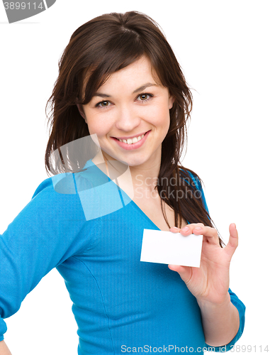 Image of Young woman is holding visit card