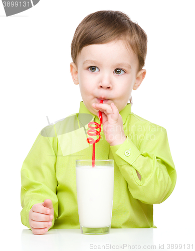 Image of Cute little boy with a glass of milk