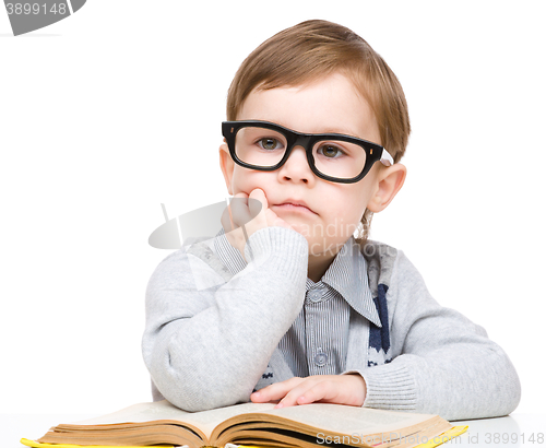 Image of Little child play with book