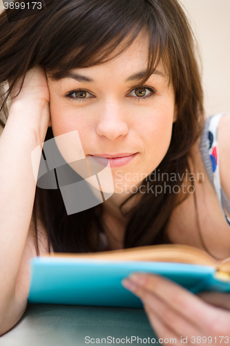 Image of Woman is reading a book