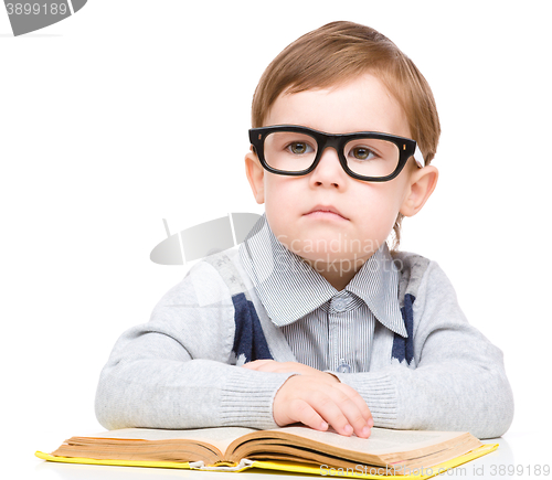 Image of Little child play with book