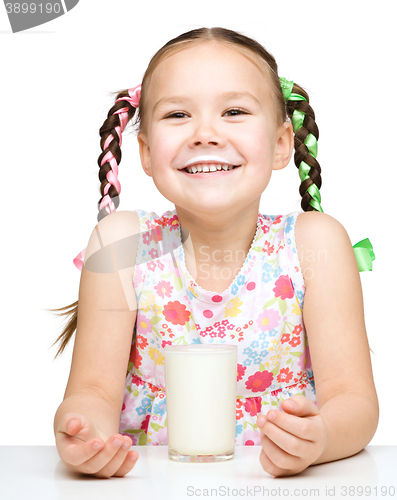 Image of Cute little girl showing milk moustache