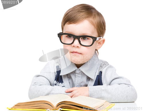 Image of Little child play with book