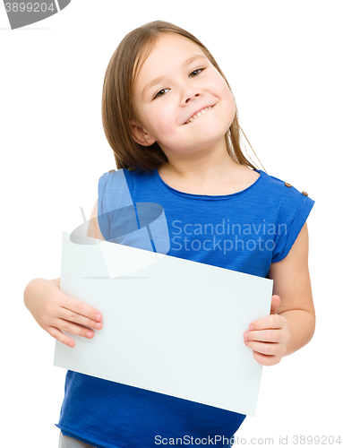 Image of Little girl is holding blank banner