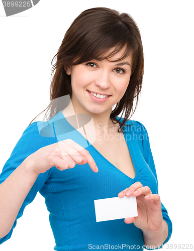 Image of Young woman is holding visit card