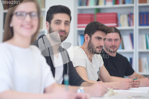 Image of group of students study together in classroom