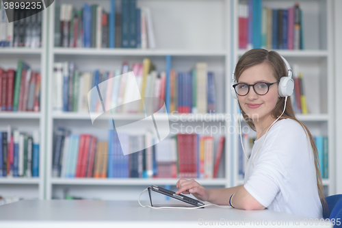 Image of female student study in library