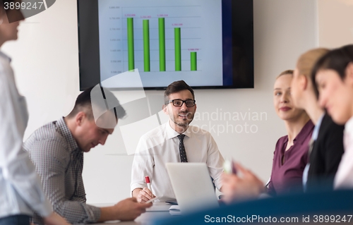 Image of young business people group on team meeting at modern office