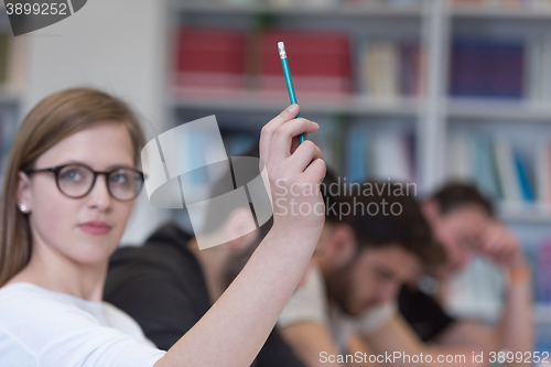 Image of group of students  raise hands up